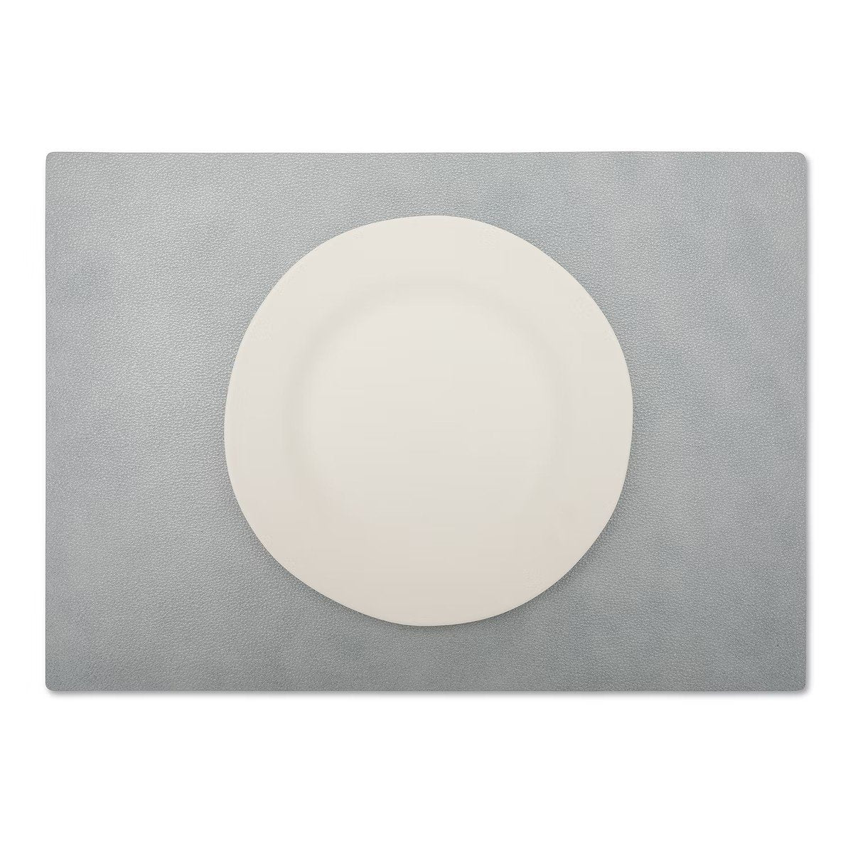 A large rectangular textured washable paper placemat in grey is shown under a white plate.