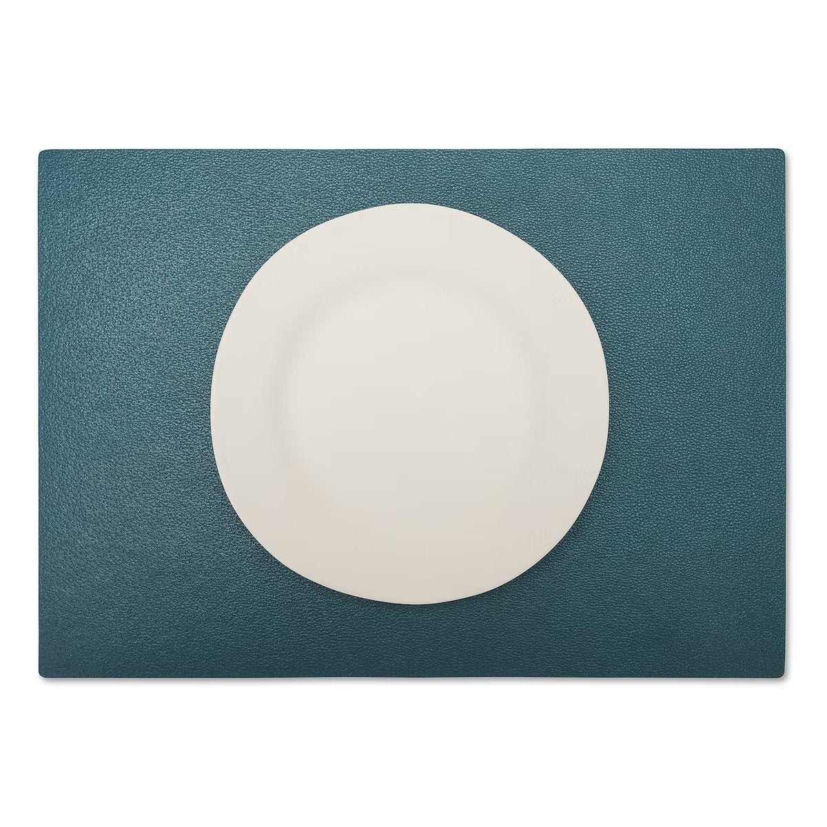A large rectangular textured washable paper placemat in teal is shown under a white plate.