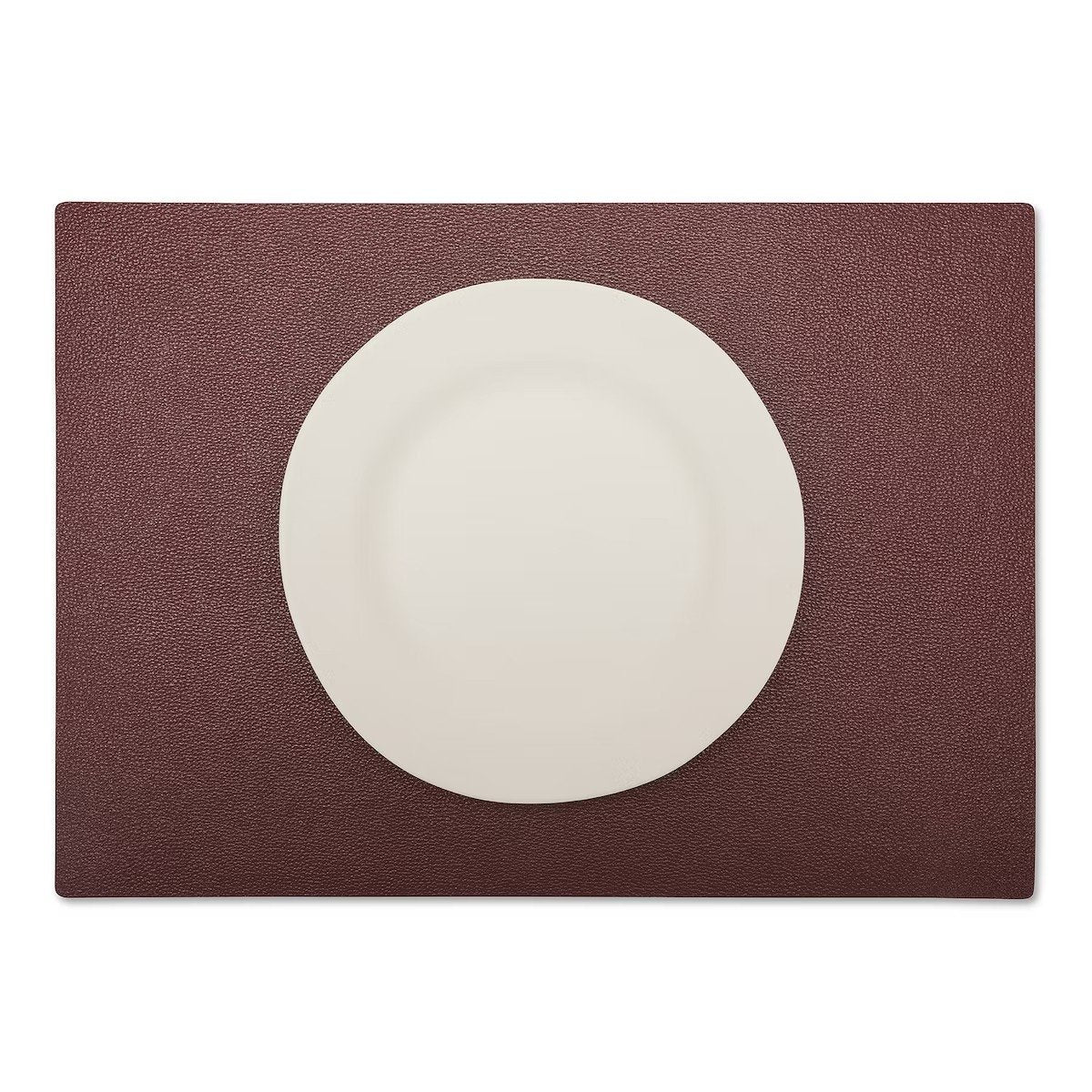 A large rectangular textured washable paper placemat in dark red is shown under a white plate.