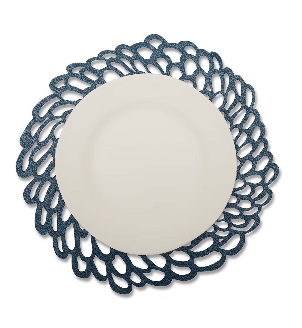 A lace effect washable paper circular placemat is shown in navy, under a white plate.