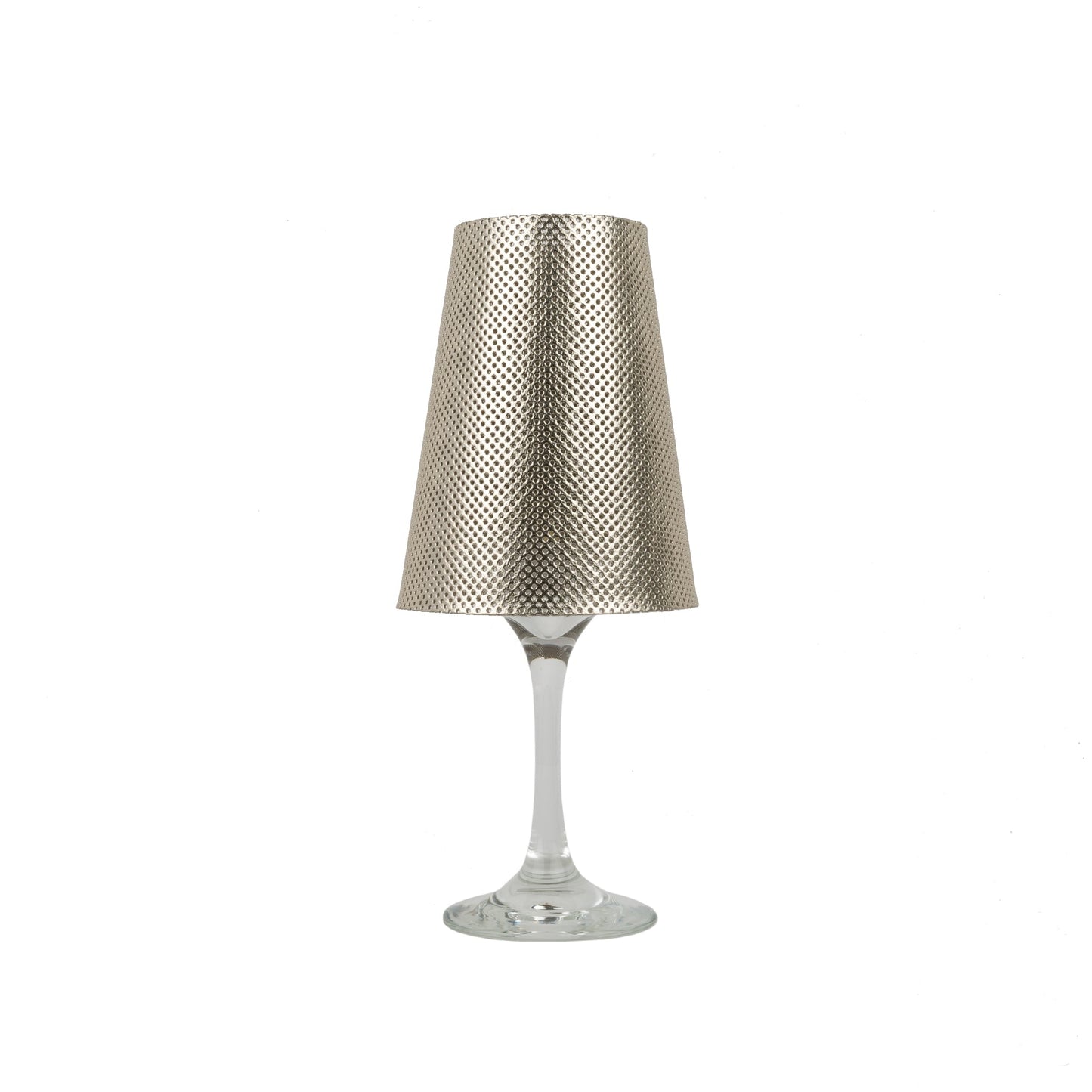 A gold metallic perforated washable paper lampshade is shown sitting atop a wine glass.