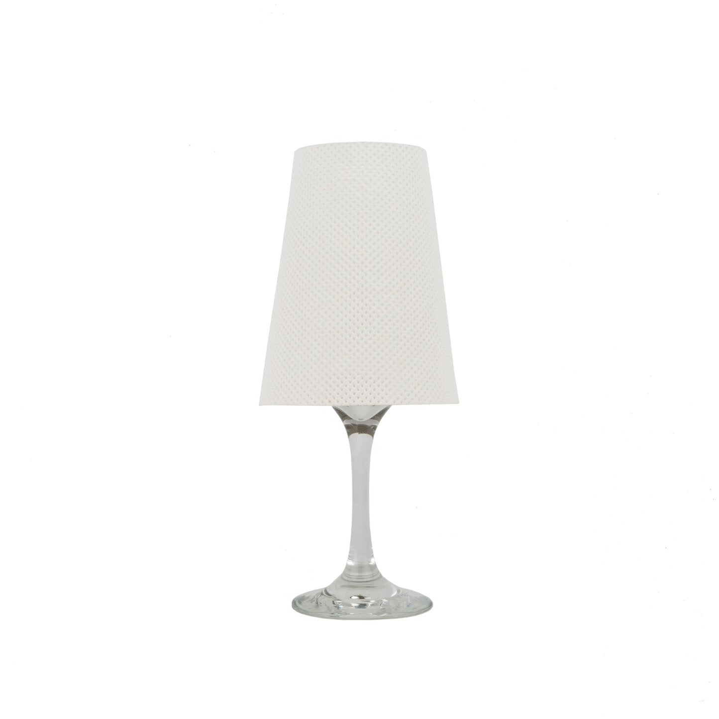 A white washable paper lampshade is shown sitting atop a wine glass.