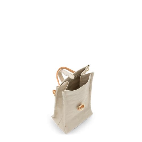 A washable paper phone holder pouch is shown in cream, with a tan handle and gold hardware. 