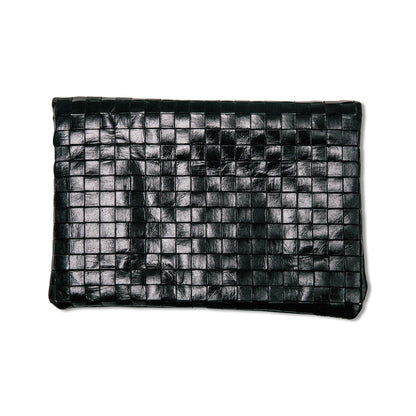 A woven washable paper clutchbag is shown from the front in black.