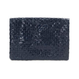 A woven washable paper clutchbag is shown from the front in navy.