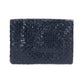 A woven washable paper clutchbag is shown from the front in navy.