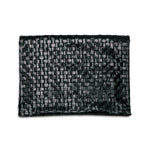 A woven washable paper clutch is shown from the front in black.