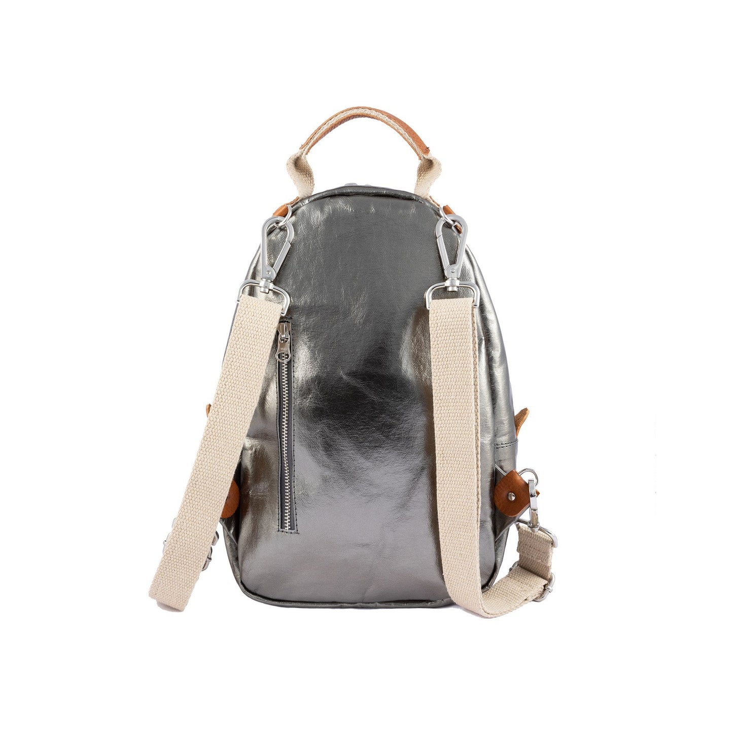 A pewter metallic washable paper backpack is shown from a back angle. It features two adjustable cream canvas shoulder straps and a silver zip pocket in the rear.