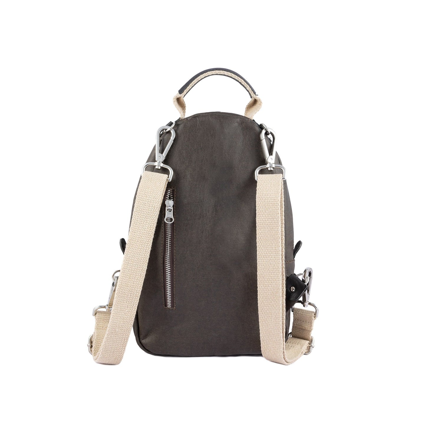 A dark grey washable paper backpack is shown from a back angle. It features two adjustable cream canvas shoulder straps and a silver zip pocket in the rear.