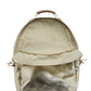A washable paper oval shaped backpack is shown from the front angle, unzipped and open. It reveals two inner pockets in a cotton lining. The backpack is metallic gold in colour.