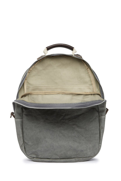 A washable paper oval shaped backpack is shown from the front angle, unzipped and open. It reveals two inner pockets in a cotton lining. The backpack is grey in colour.