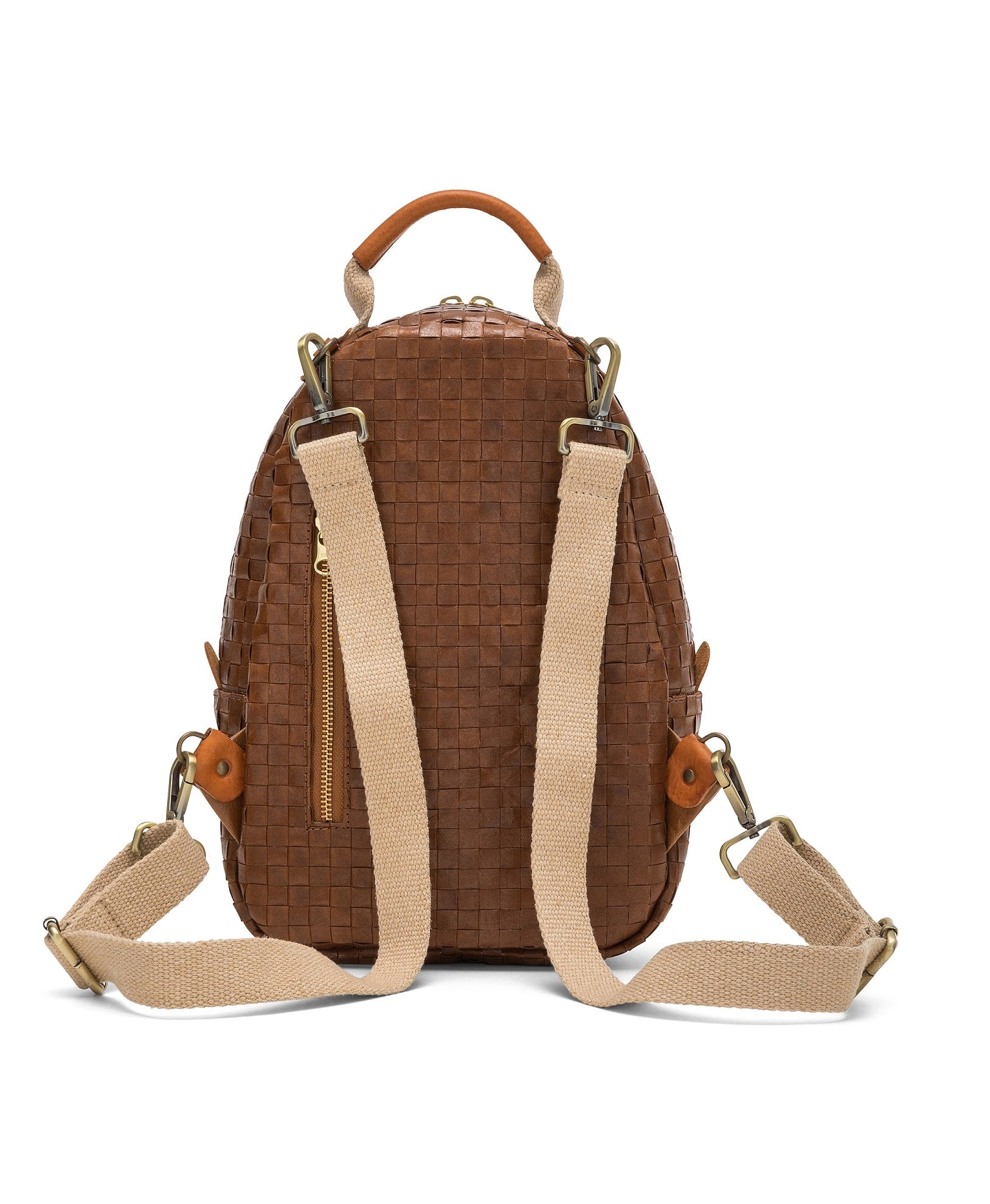 A washable paper backpack is shown from the back angle. It features a top handle, two canvas shoulder straps, and a gold zip pocket at rear. It is brown in colour.
