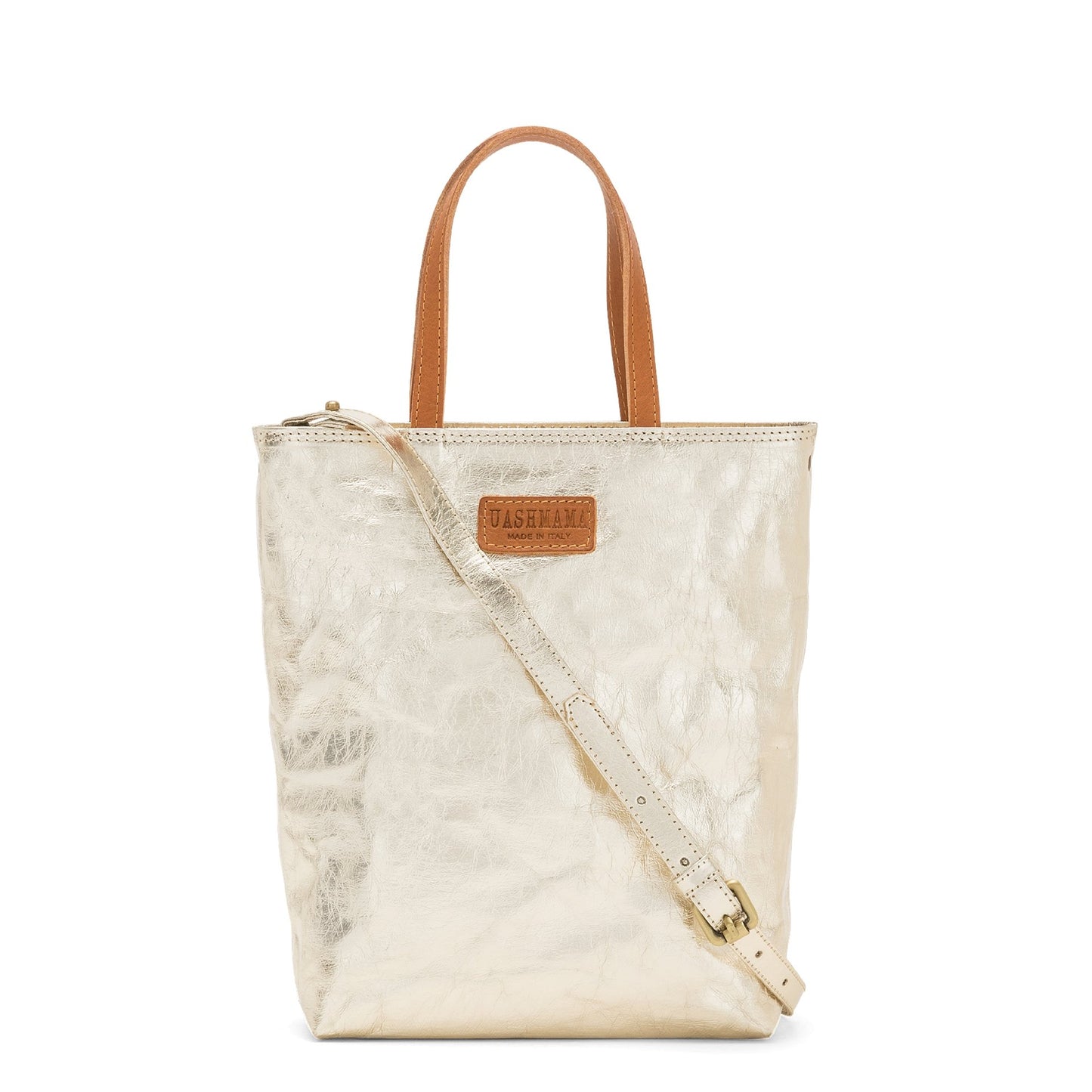 A washable paper rectangular tote with long top handles and a long shoulder strap is shown from the front angle. It is metallic gold in colour.