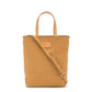 A washable paper rectangular tote with long top handles and a long shoulder strap is shown from the front angle. It is pale tan in colour.