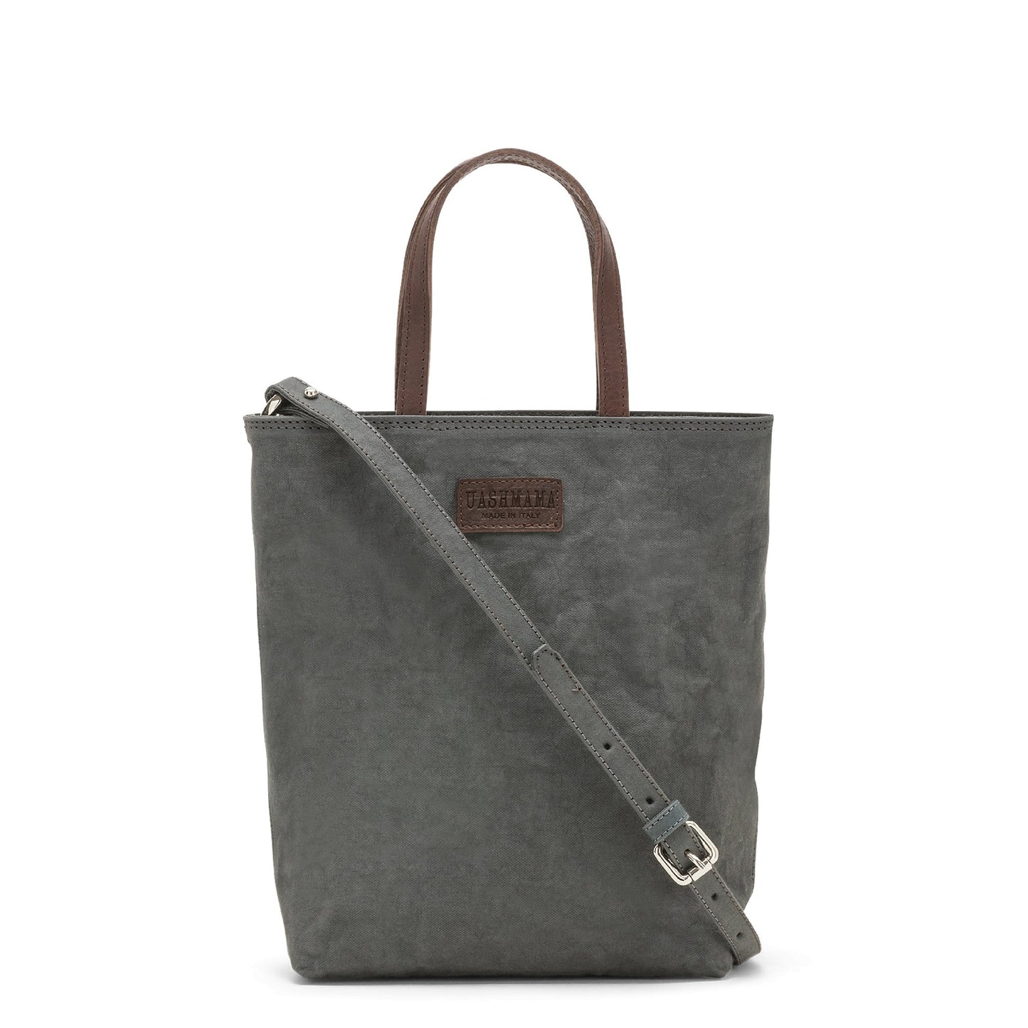 A washable paper rectangular tote with long top handles and a long shoulder strap is shown from the front angle. It is dark grey in colour.