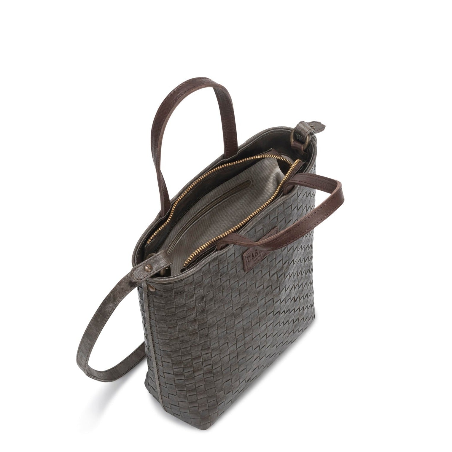 A woven washable paper tote bag is shown from a top-down angle, unzipped to reveal an inside zip pocket. It is grey-brown in colour.