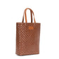 A woven washable tote bag is shown from a 3/4 angle. It has two top handles and is brown in colour.