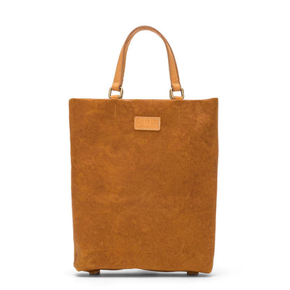 A rectangular washable paper tote bag is shown, with two top handles and a logo UASHMAMA stamp on the front. It is bright tan in colour.