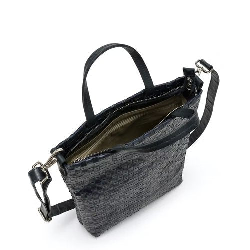A woven washable paper tote bag is shown unzipped, from a top down angle. It is black in colour.