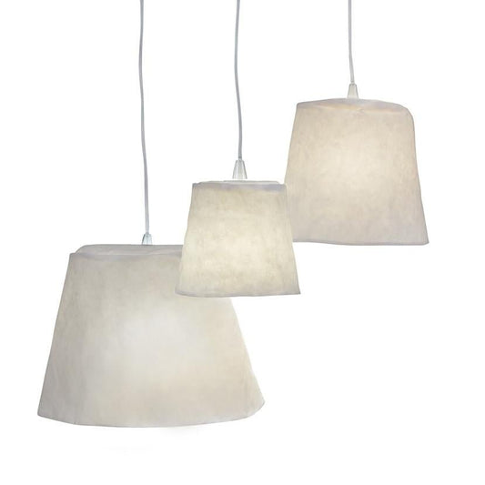Three washable paper pendant lamps are shown hanging in varying sizes. They are white in colour.