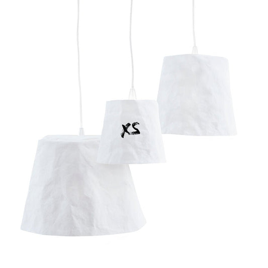 Three washable paper pendant lamps are shown hanging in varying sizes. They are white in colour. The one in the middle has "XS" painted on it.