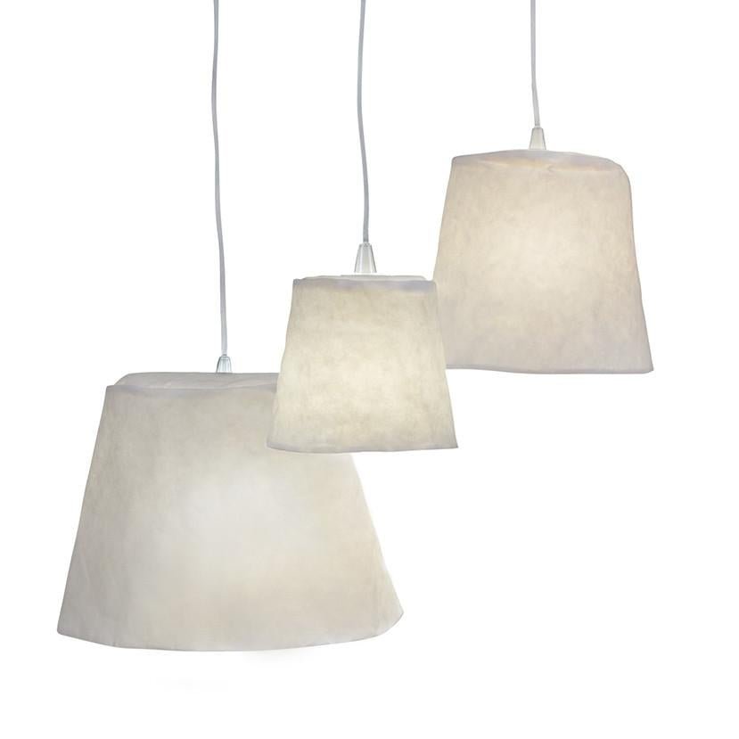 Three washable paper pendant lamps are shown hanging in varying sizes. They are white in colour.