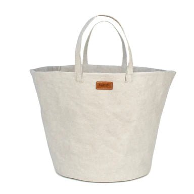 An washable paper basket is shown from the front angle. It has two top handles, a brown UASHMAMA logo tab on the front, and is shown in a white colour.