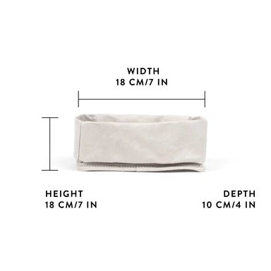A washable paper tray is shown from a side angle. It is rectangular in shape and cream in colour. It shows a graphic displaying its measurements - 18cm wide x 18cm high x 10cm deep.