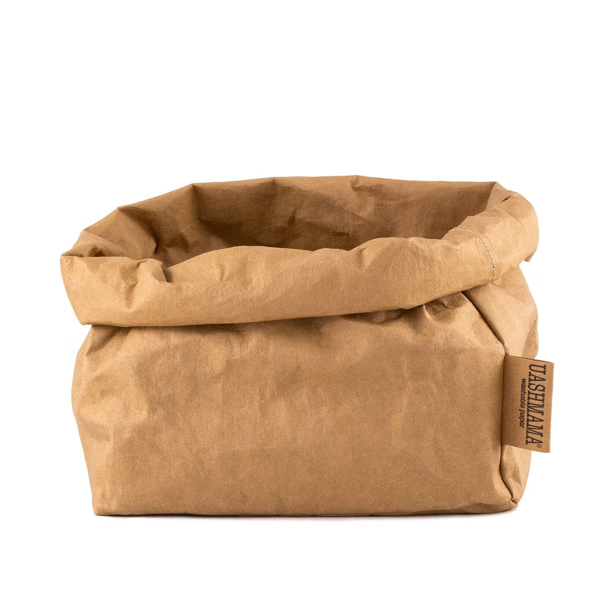 A washable paper bag is shown. The bag is rolled down at the top and features a UASHMAMA logo label on the bottom left corner. The bag pictured is the large size in tan.