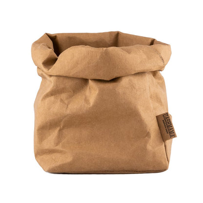 A washable paper bag is shown. The bag is rolled down at the top and features a UASHMAMA logo label on the bottom left corner. The bag pictured is the large plus size in tan.