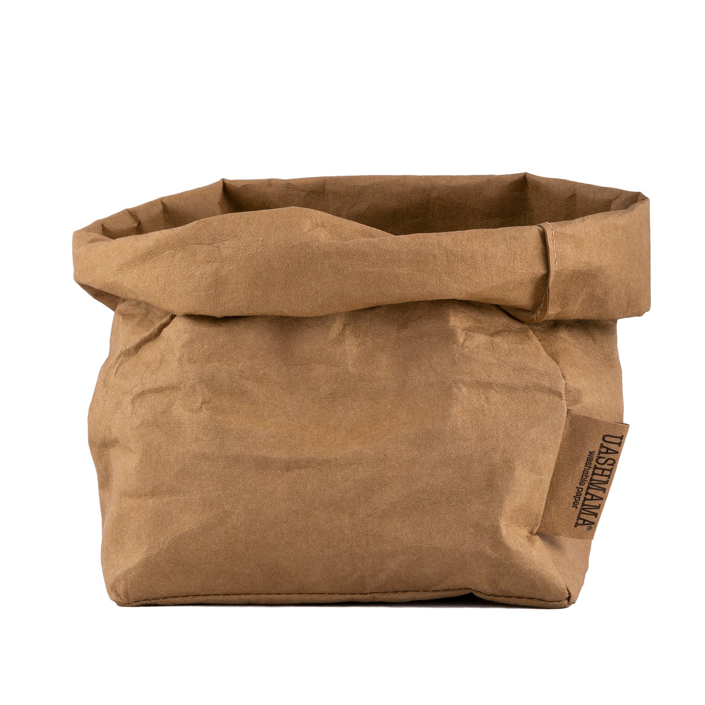 A washable paper bag is shown. The bag is rolled down at the top and features a UASHMAMA logo label on the bottom left corner. The bag pictured is the medium size in tan.