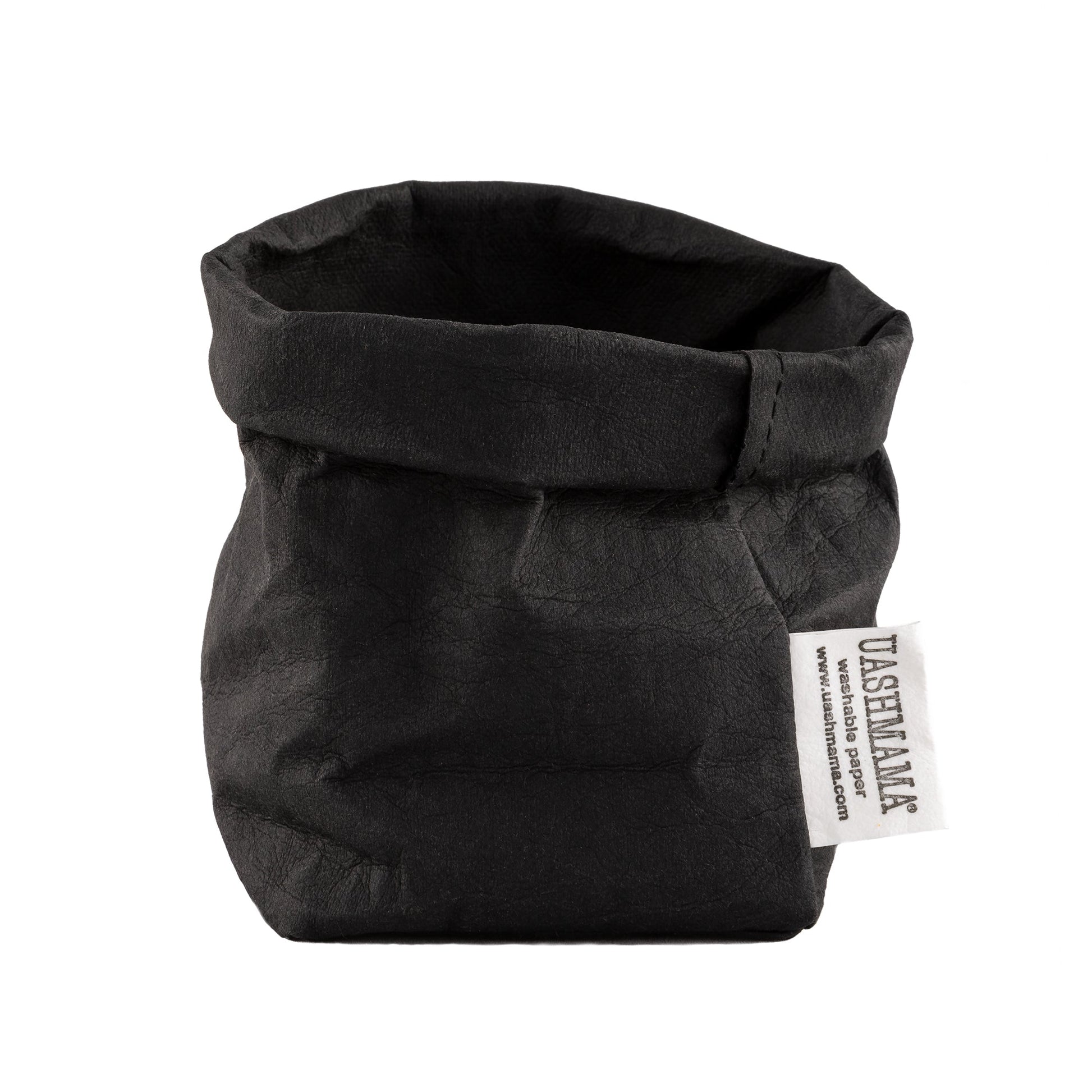 A washable paper bag is shown. The bag is rolled down at the top and features a UASHMAMA logo label on the bottom left corner. The bag pictured is the piccolo size in black.