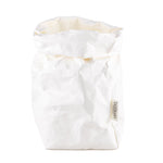 A washable paper bag is shown. The bag is rolled down at the top and features a UASHMAMA logo label on the bottom left corner. The bag pictured is the extra large size in white.