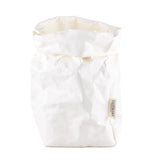 A washable paper bag is shown. The bag is rolled down at the top and features a UASHMAMA logo label on the bottom left corner. The bag pictured is the extra large size in white.