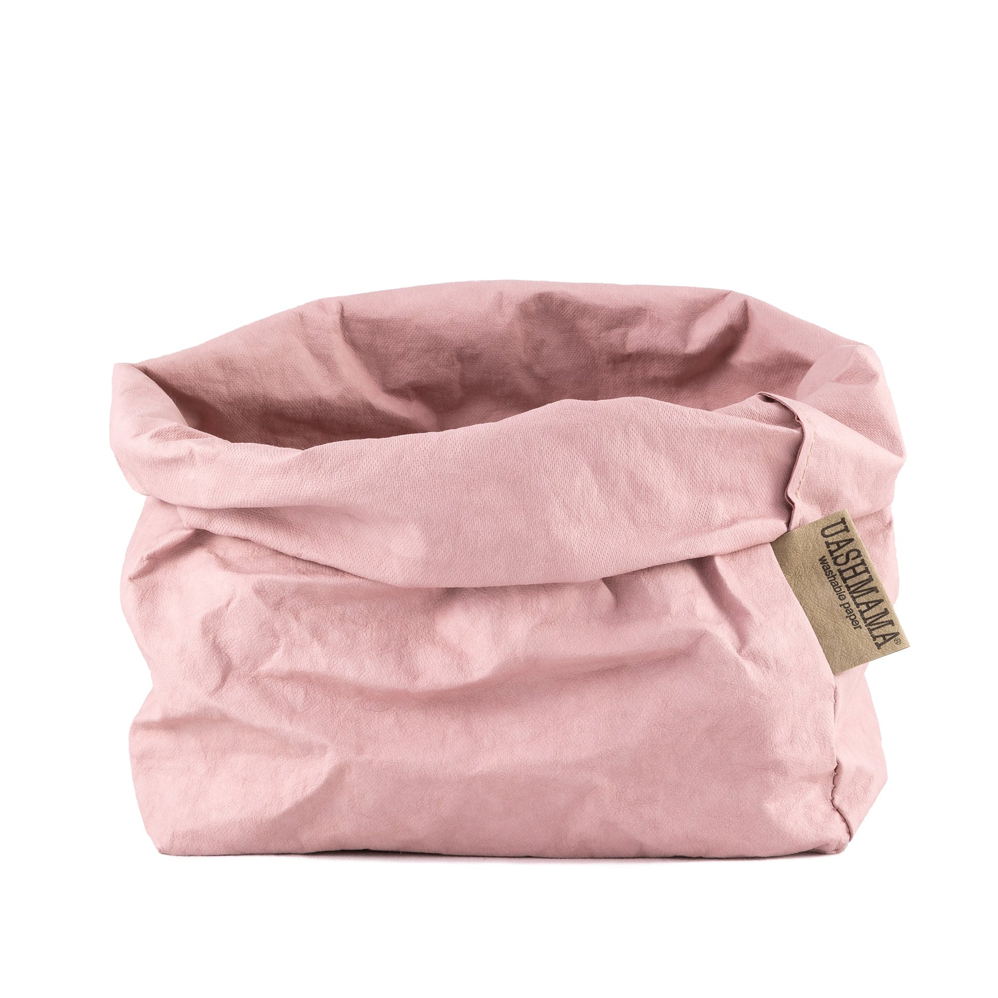 A washable paper bag is shown. The bag is rolled down at the top and features a UASHMAMA logo label on the bottom left corner. The bag pictured is the large size in pale pink.