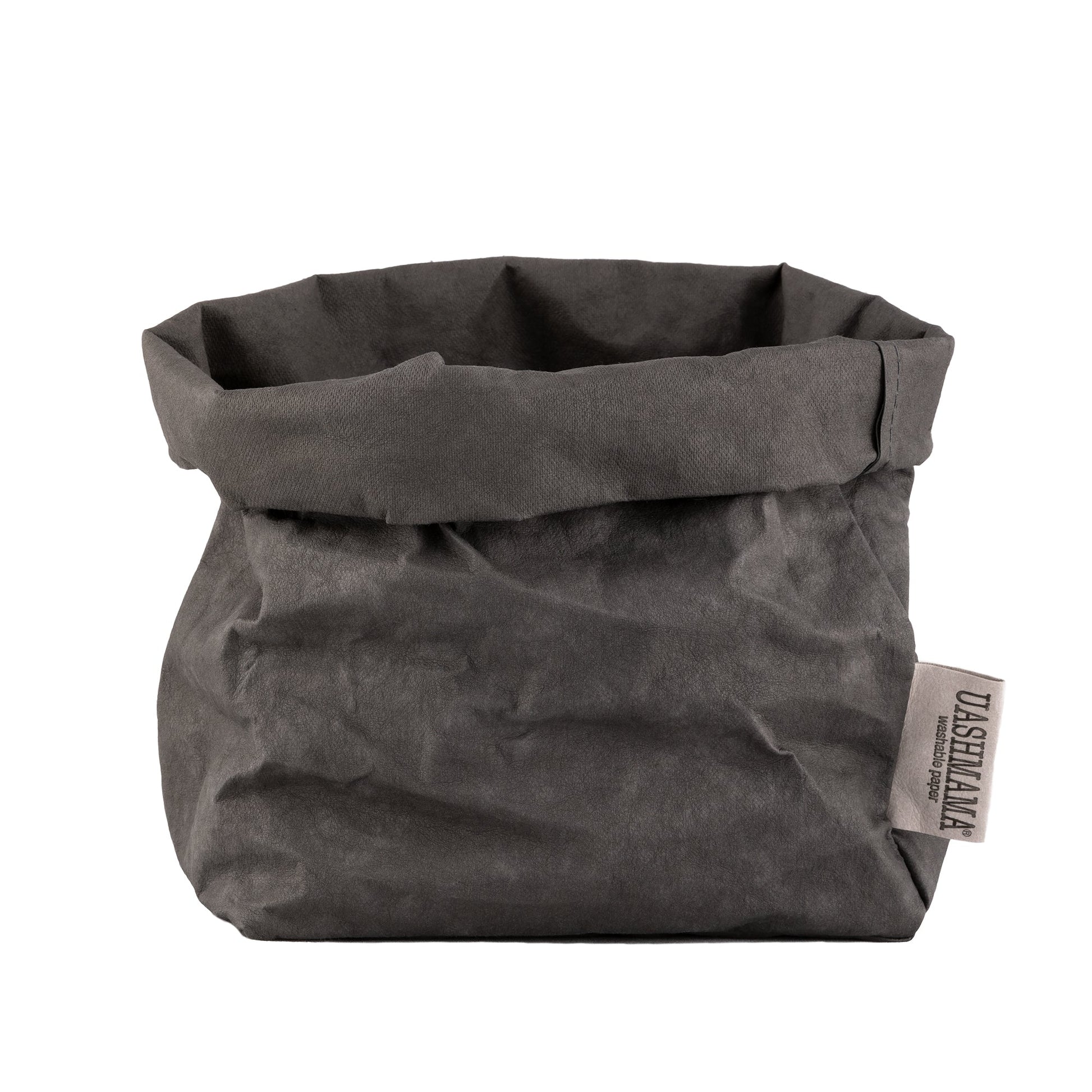 A washable paper bag is shown. The bag is rolled down at the top and features a UASHMAMA logo label on the bottom left corner. The bag pictured is the medium size in dark grey.