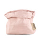A washable paper bag is shown. The bag is rolled down at the top and features a UASHMAMA logo label on the bottom left corner. The bag pictured is the medium size in pale pink.