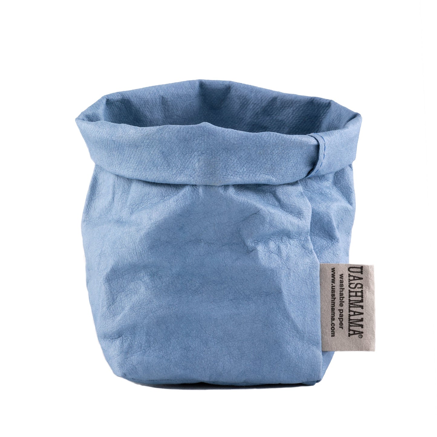 A washable paper bag is shown. The bag is rolled down at the top and features a UASHMAMA logo label on the bottom left corner. The bag pictured is the piccolo size in light blue.