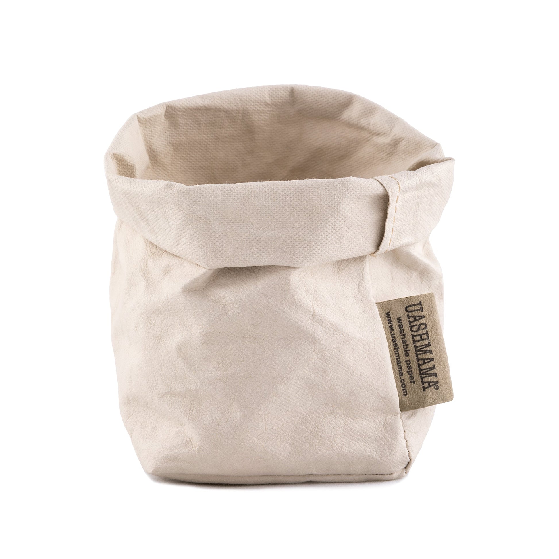 A washable paper bag is shown. The bag is rolled down at the top and features a UASHMAMA logo label on the bottom left corner. The bag pictured is the piccolo size in cream.