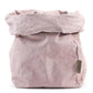 A washable paper bag is shown. The bag is rolled down at the top and features a UASHMAMA logo label on the bottom left corner. The bag pictured is the extra large size in pale pink.