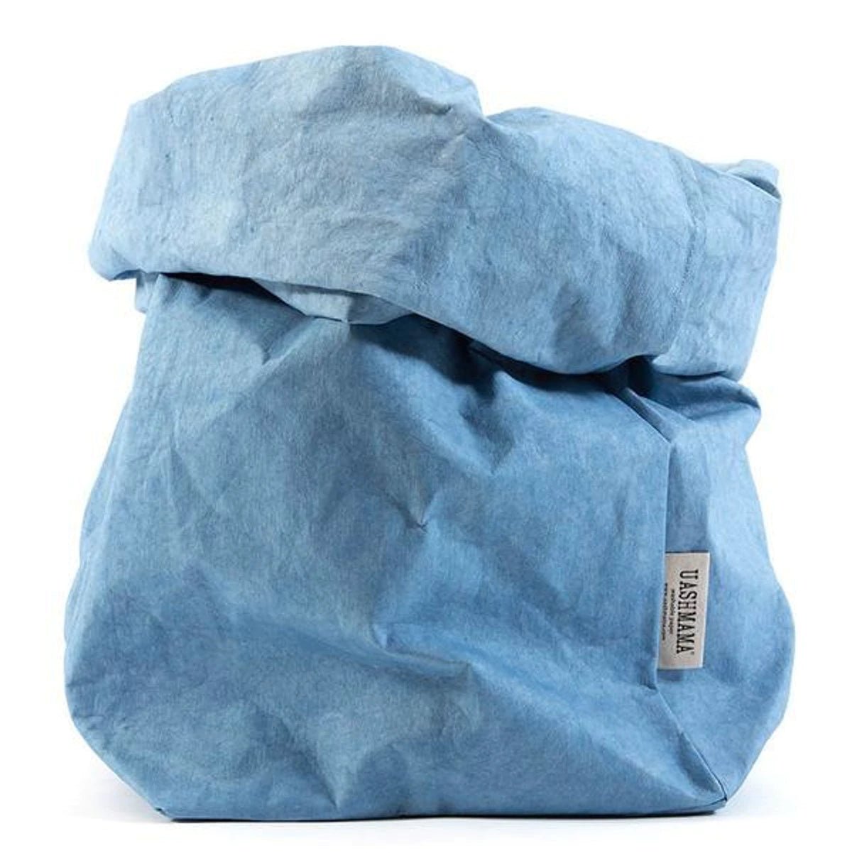 A washable paper bag is shown. The bag is rolled down at the top and features a UASHMAMA logo label on the bottom left corner. The bag pictured is the extra large size in light blue.