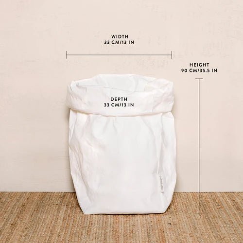 A washable paper bag is shown. The bag is rolled down at the top and features a UASHMAMA logo label on the bottom left corner. The bag pictured is the extra extra large size in white. The dimensions are shown on the image.