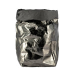 A washable paper bag is shown. The bag is rolled down at the top and features a UASHMAMA logo label on the bottom left corner. The bag pictured is the extra large size in metallic dark grey.