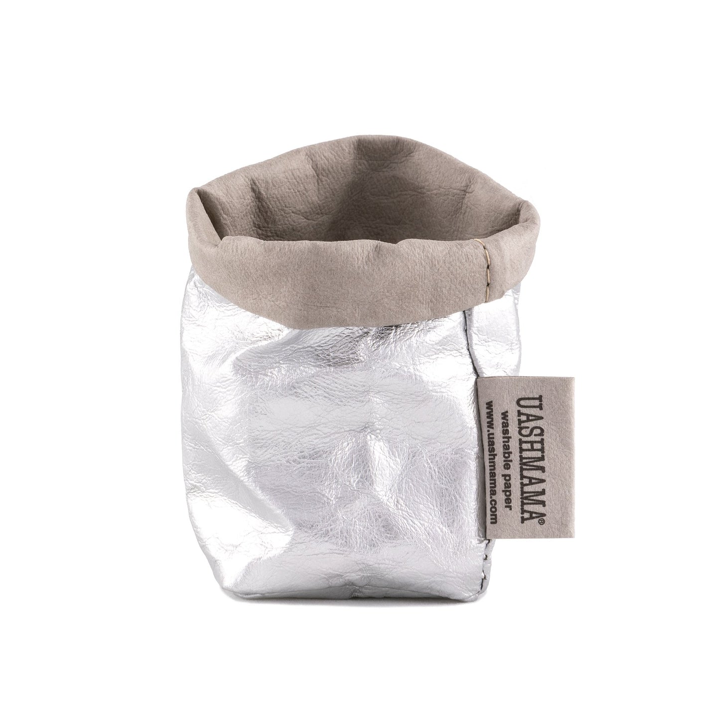 A washable paper bag is shown. The bag is rolled down at the top and features a UASHMAMA logo label on the bottom left corner. The bag pictured is the extra small size in metallic silver.