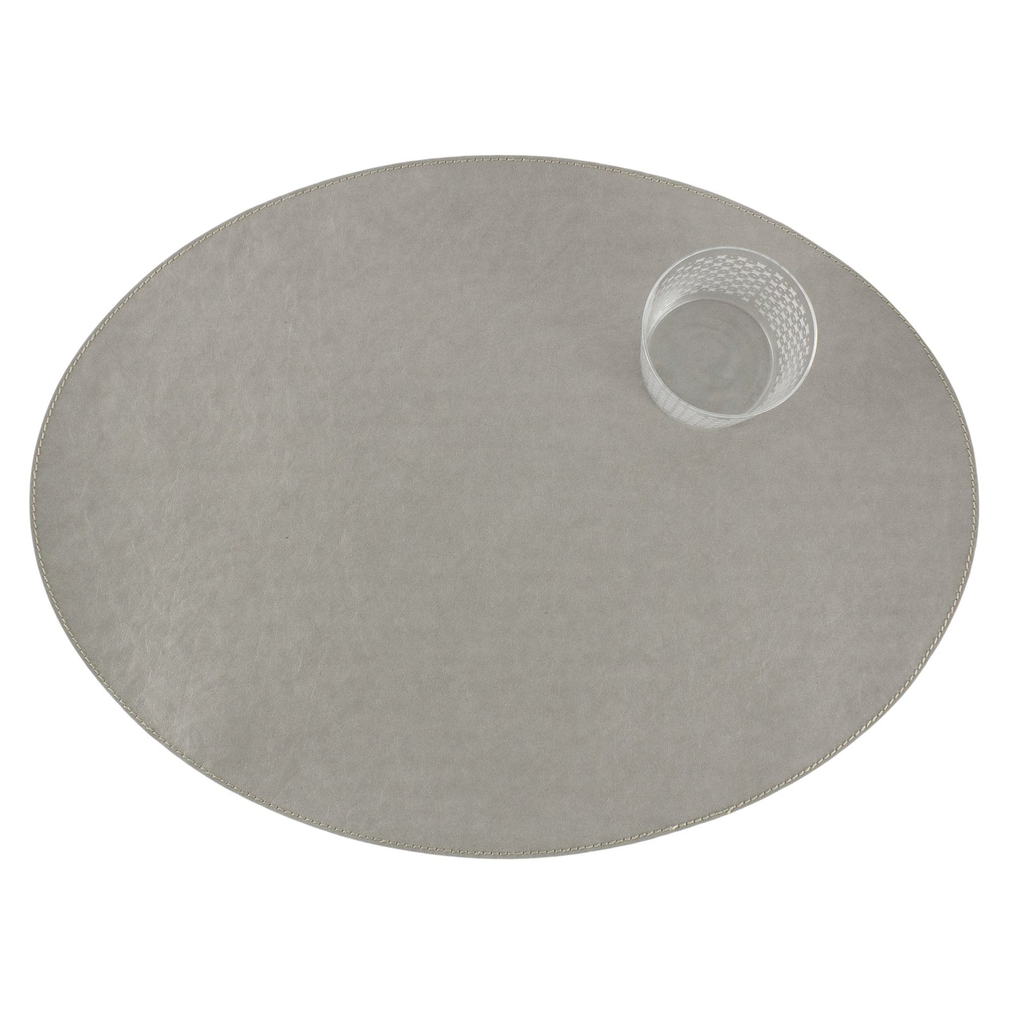 An oval washable paper placemats is shown with a small drinking glass in the upper right hand corner. The placemat shown is pale grey.