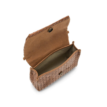 A woven washable paper handbag is shown. The bag has a front flap closure and a washable paper strap attached to the bag by metal clips. The bag is shown in tan. The bag is shown open showing the organic cotton lining and the circle magnetic closure.