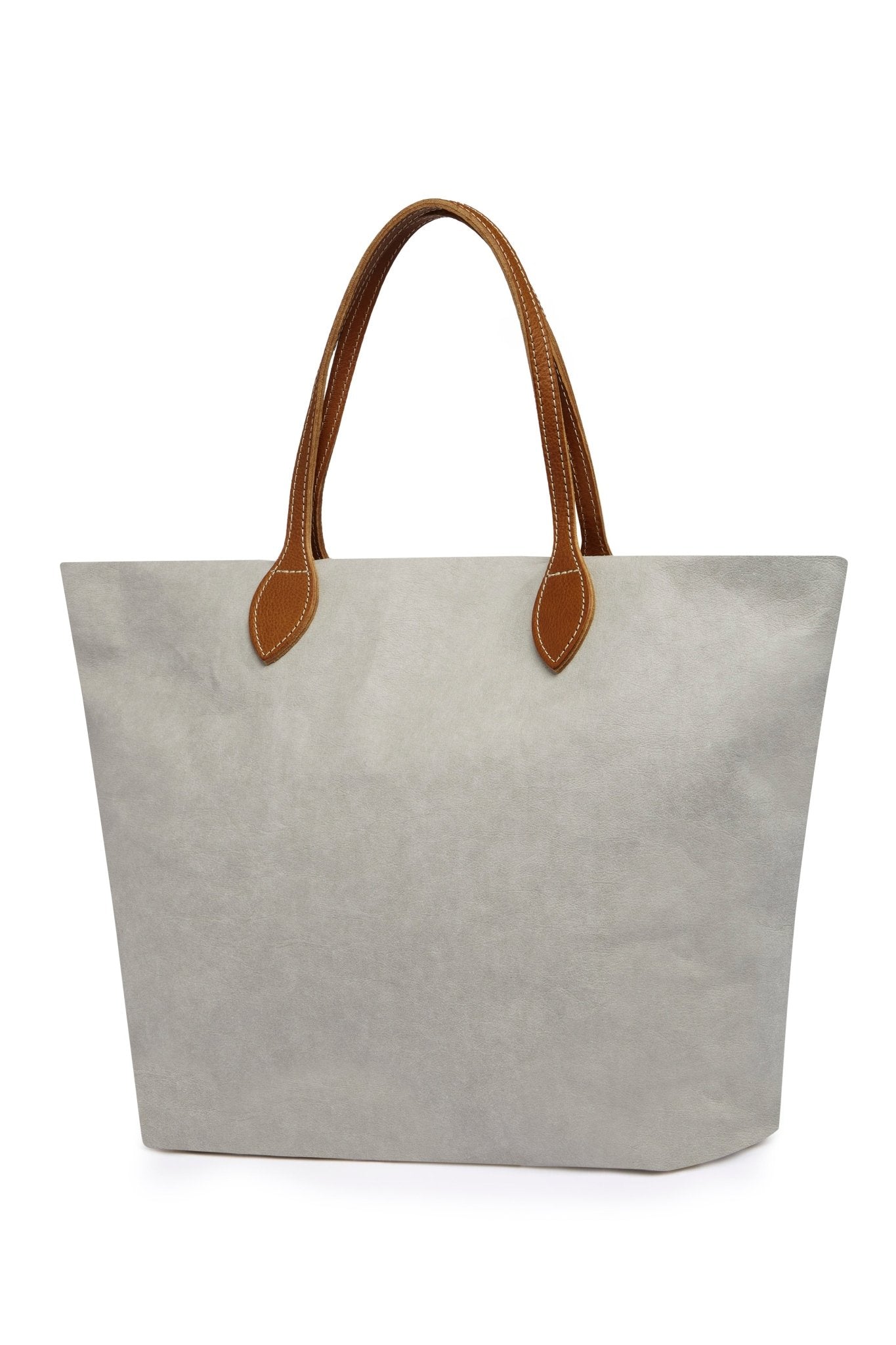 A large washable paper tote is shown. It has two long tan leather handles. The bag shown is pale grey with tan handles.