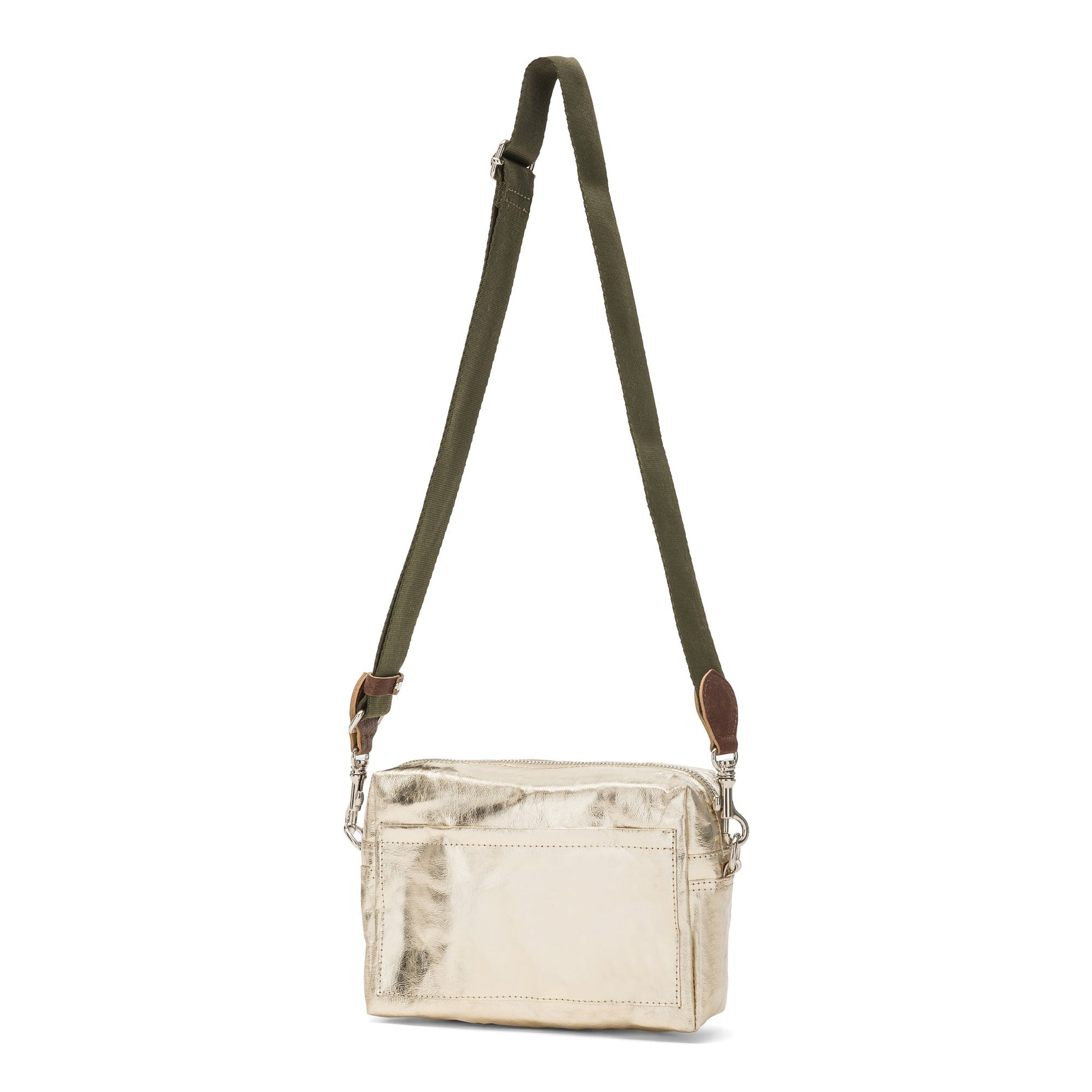 A rectangular washable paper handbag with an external side pocket is shown. The bag has a canvas strap, washable paper details and metal fastening clips to attach the straps to the bag. The bag closes by a zip. The bag shown is metallic platinum with an olive strap.
