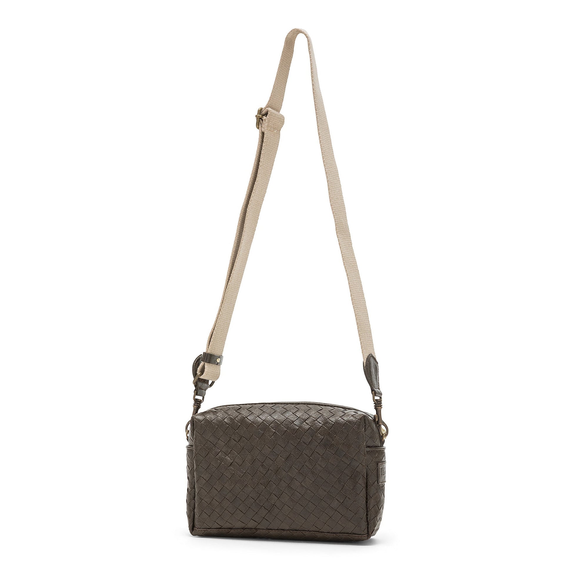 A small woven washable paper handbag is shown. The bag has a wide fabric shoulder strap. The bag is dark brown and the strap is a light wheat colour.