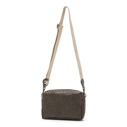 A small woven washable paper handbag is shown. The bag has a wide fabric shoulder strap. The bag is dark brown and the strap is a light wheat colour.